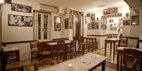 Wreck of Angels Athens — candlelit tables inside the vaulted stone bar