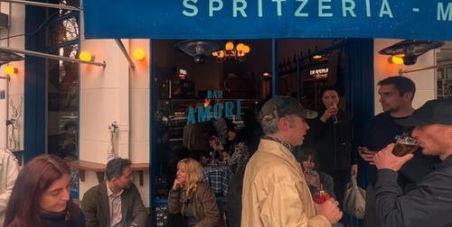 Bar Amore Athens — moody Italian-inspired interior with warm candlelight