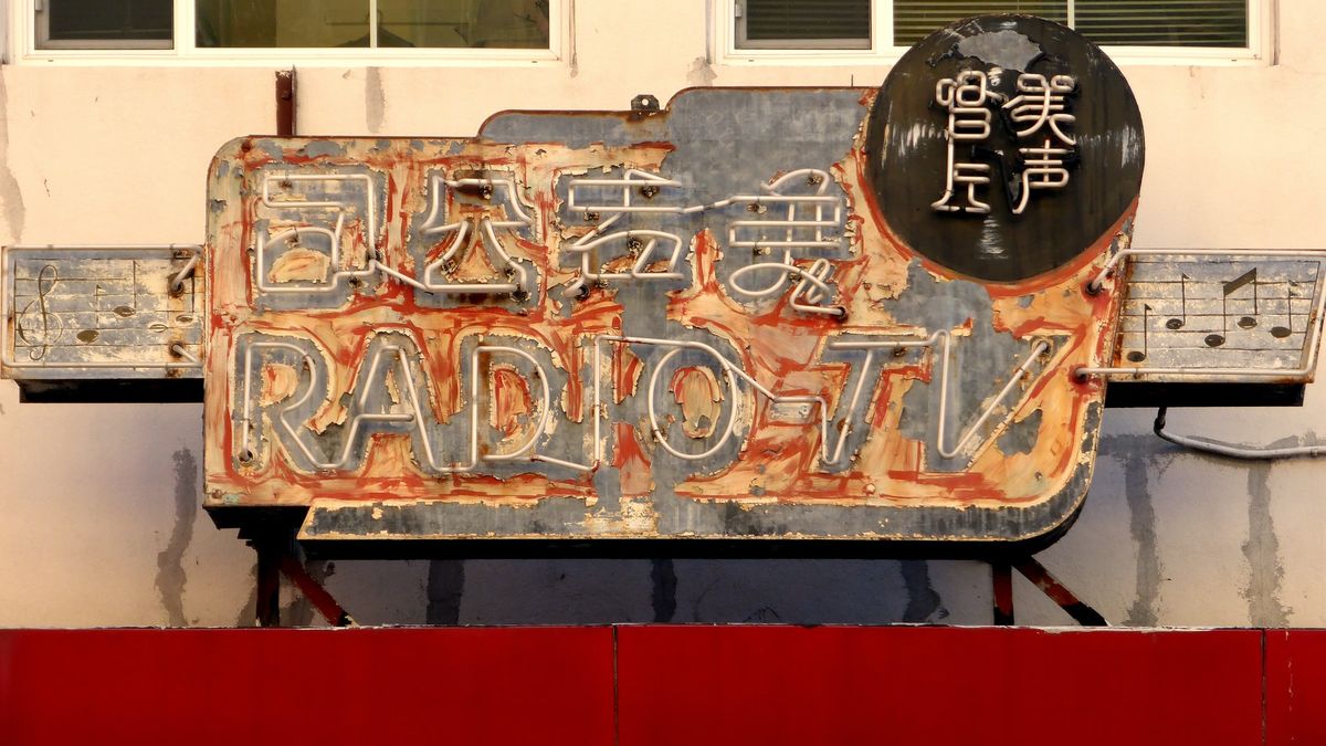 A vintage asian radio sign