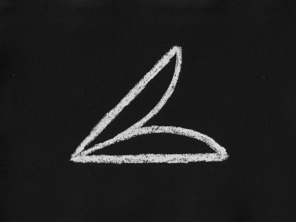 A minimalist chalk drawing on a black surface. The abstract symbol consists of a horizontal base, a diagonal line rising from the right, and a single curved line connecting the two endpoints.