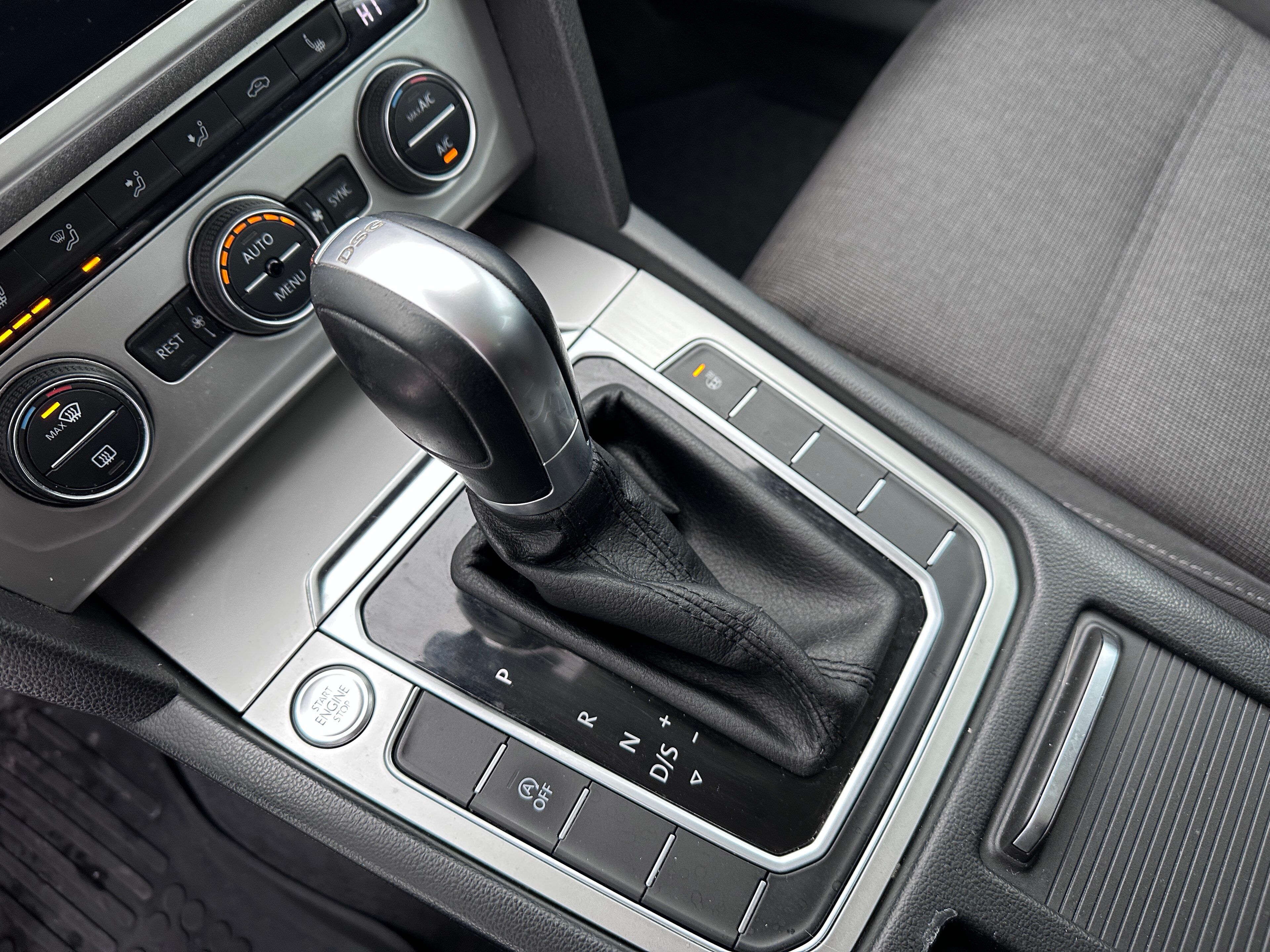 Close-up of the DSG gear selector in a Volkswagen Passat B8, with the DSG badge and P, R, N and D/S markings visible.