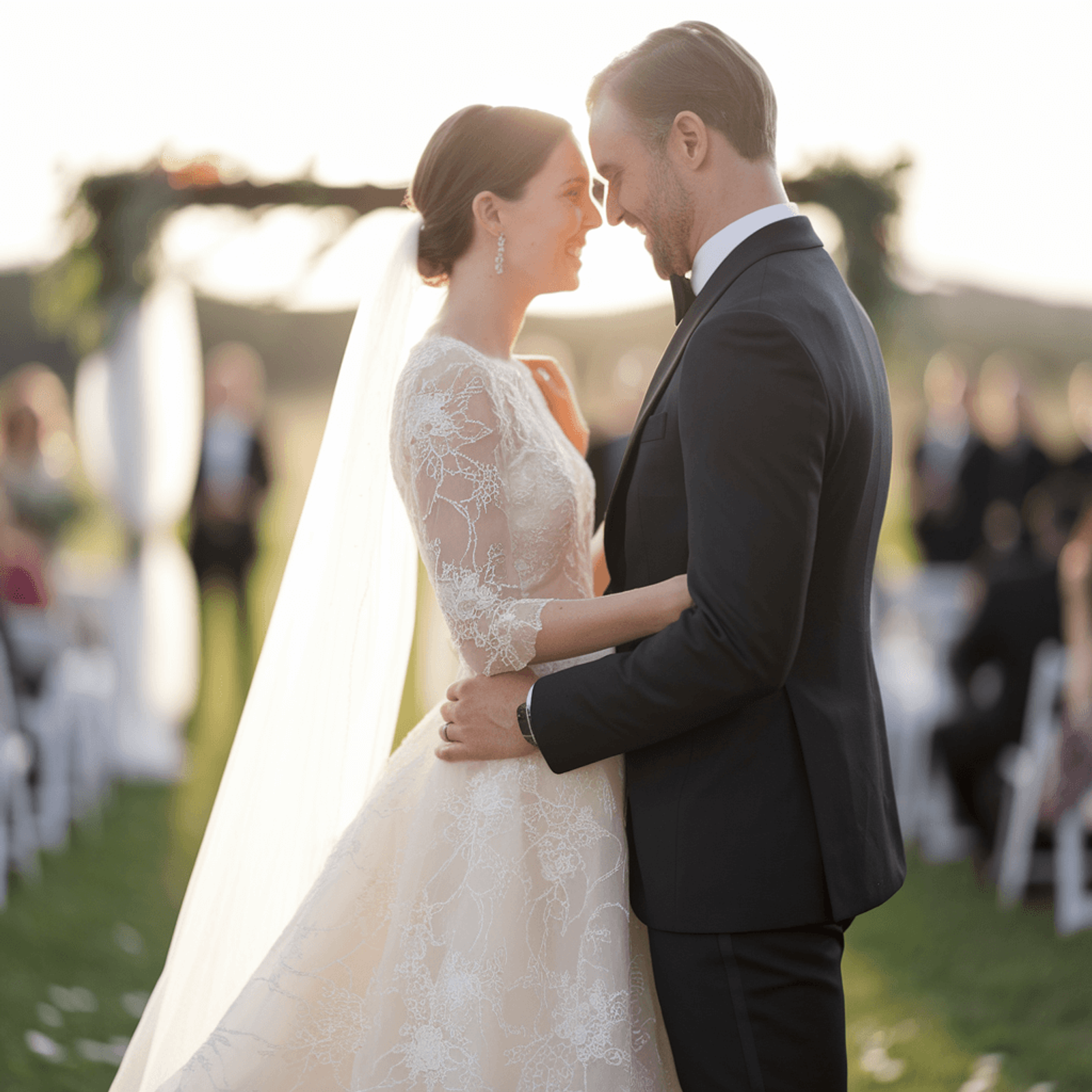 Couple in formal clothing standing forehead to forehead outdoors.