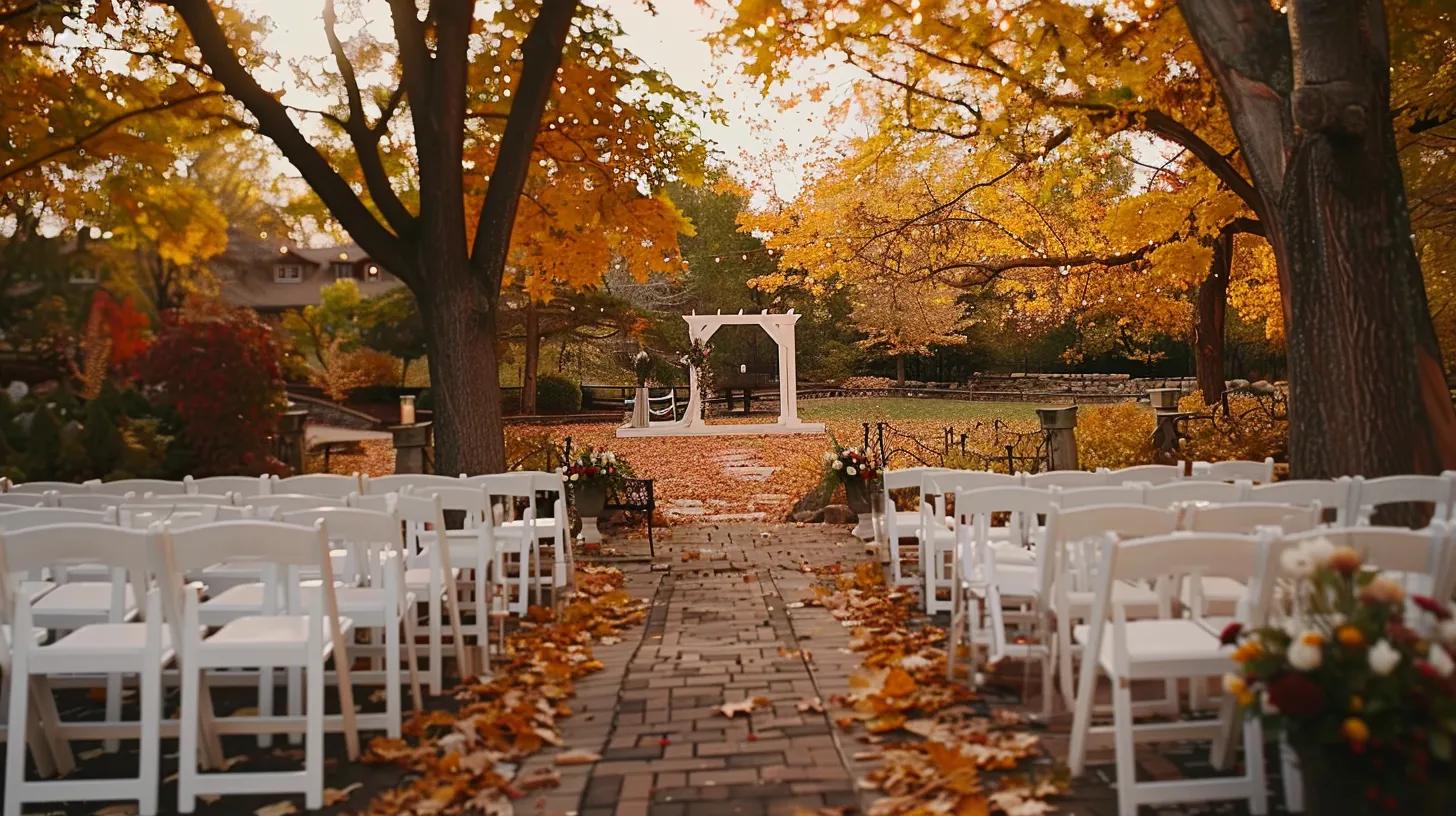 Autumn Ceremony Aisle Outdoor ceremony aisle lined with white chairs beneath orange autumn trees.