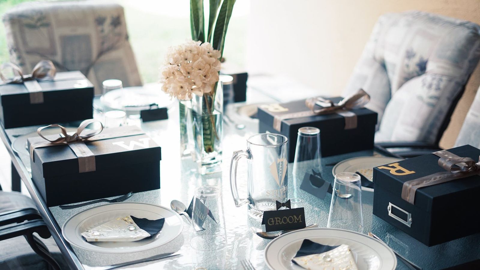 Groom Accessories Watches cufflinks boxes and grooming items arranged on a table