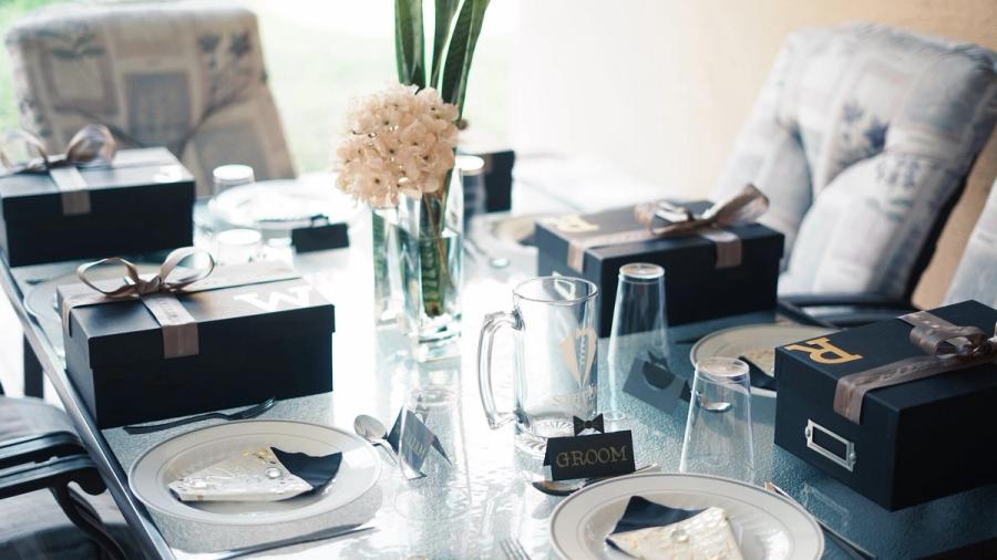 Groom Accessories Watches cufflinks boxes and grooming items arranged on a table