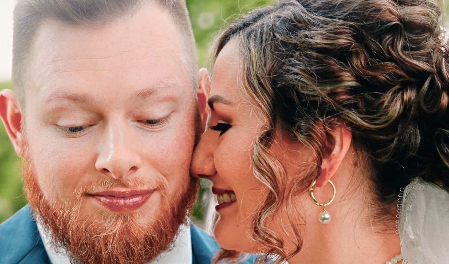 Close Outdoor Portrait Close portrait of two formally dressed people facing each other outdoors.