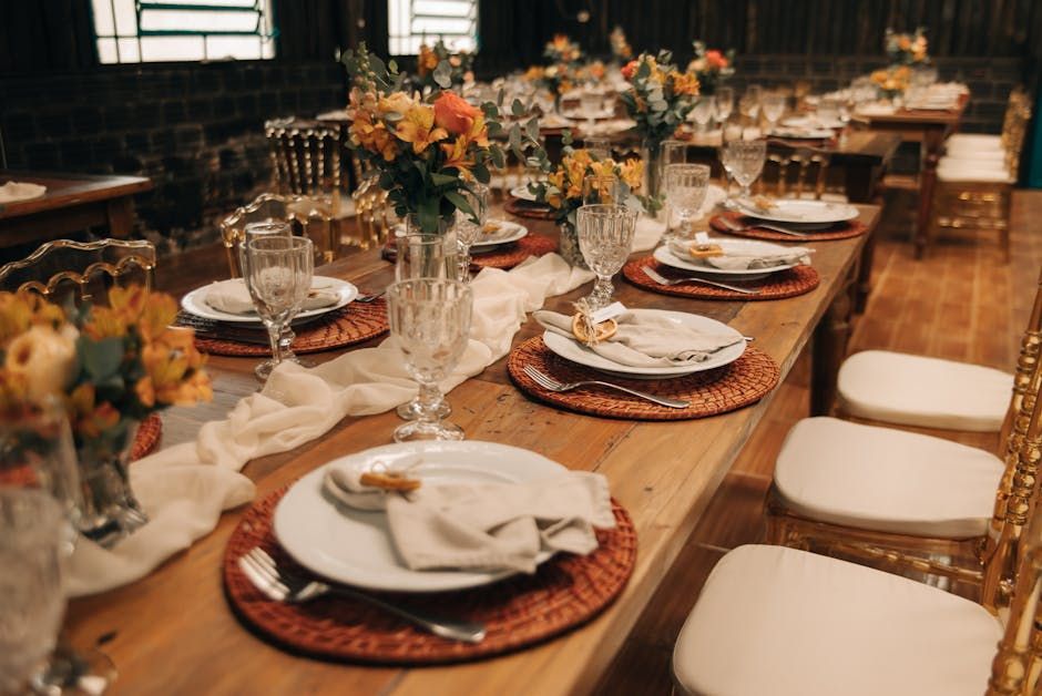 Rustic Reception Tables Rustic reception tables with orange flowers and woven placemats
