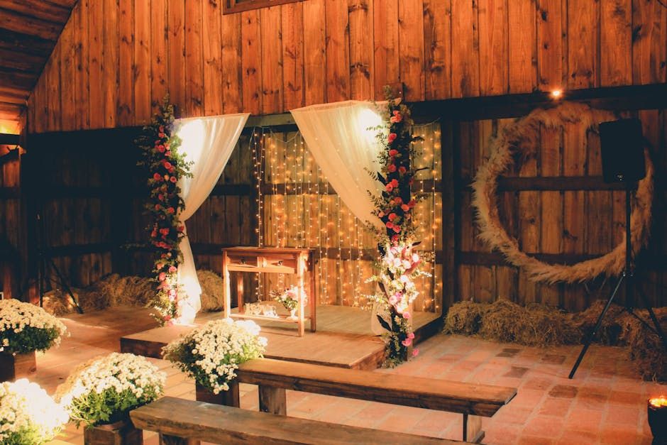 Barn Ceremony Backdrop Draped ceremony backdrop inside a wooden barn