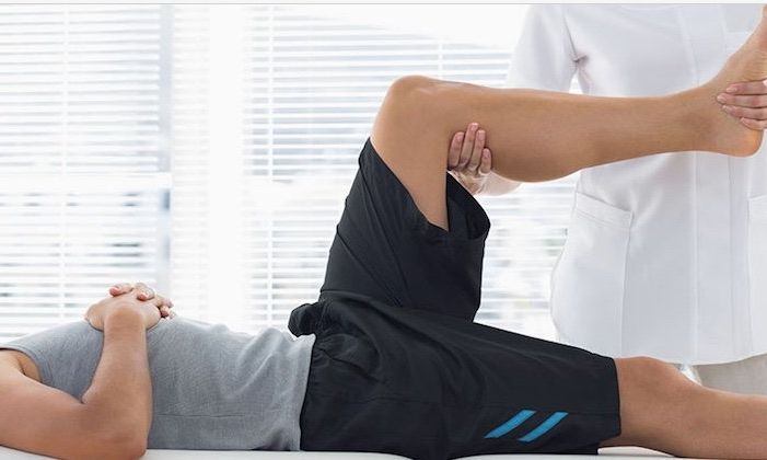patient-stretching-with-physical-therapist