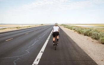 Person cycling on a road