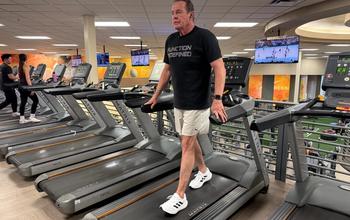 Backward walking activating posterior chain muscles including glutes, hamstrings, and lower back.