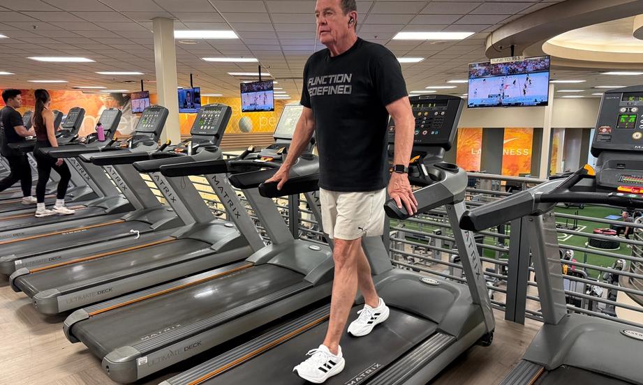 Backward walking activating posterior chain muscles including glutes, hamstrings, and lower back.