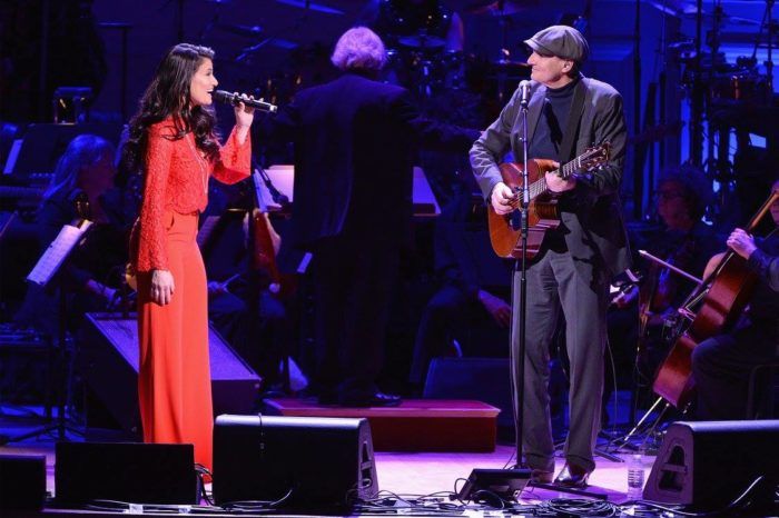 The main event! James with Idina Menzel. (Photo: Kevin Mazur / Getty Images)