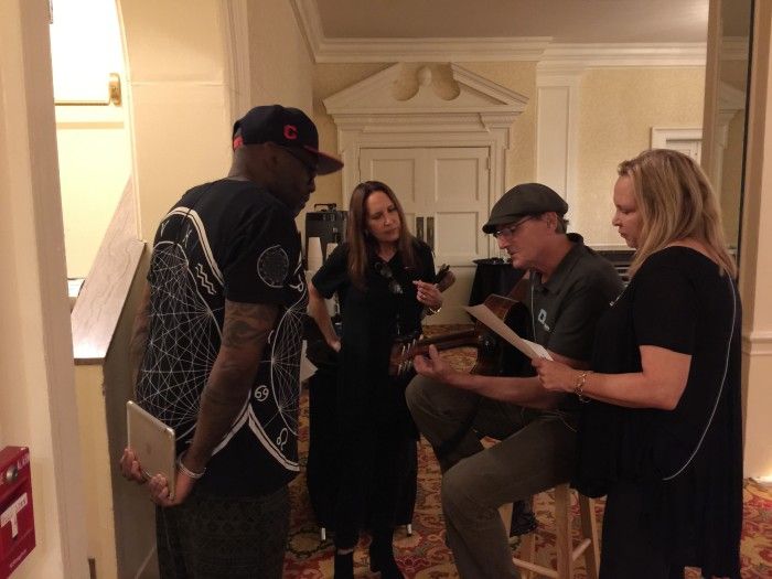 Arnold, Kate, James and Kim go over an arrangement. Photo by Ellyn Kusmin.