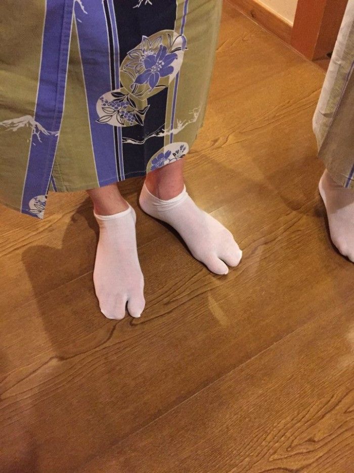 James trying out traditional footwear.