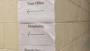 Before James and the band arrive, someone has to put up signs telling everyone where to find their dressing rooms and offices. (Photo: Michael Drazdzinski)