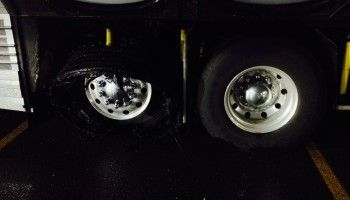 A bus with a flat tour: part of the casulaties of touring. (Photo: Jimmy Johnson)