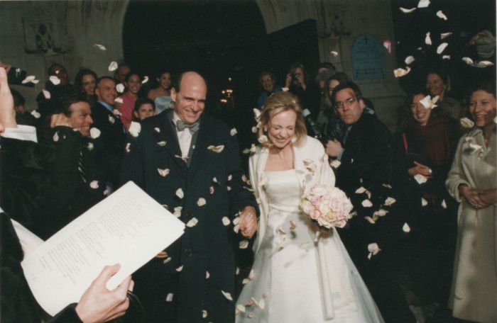 Shower of rose petals leaving the church