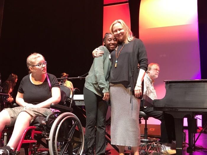 Kim with members of the children’s chorus. Photo by Ellyn Kusmin.