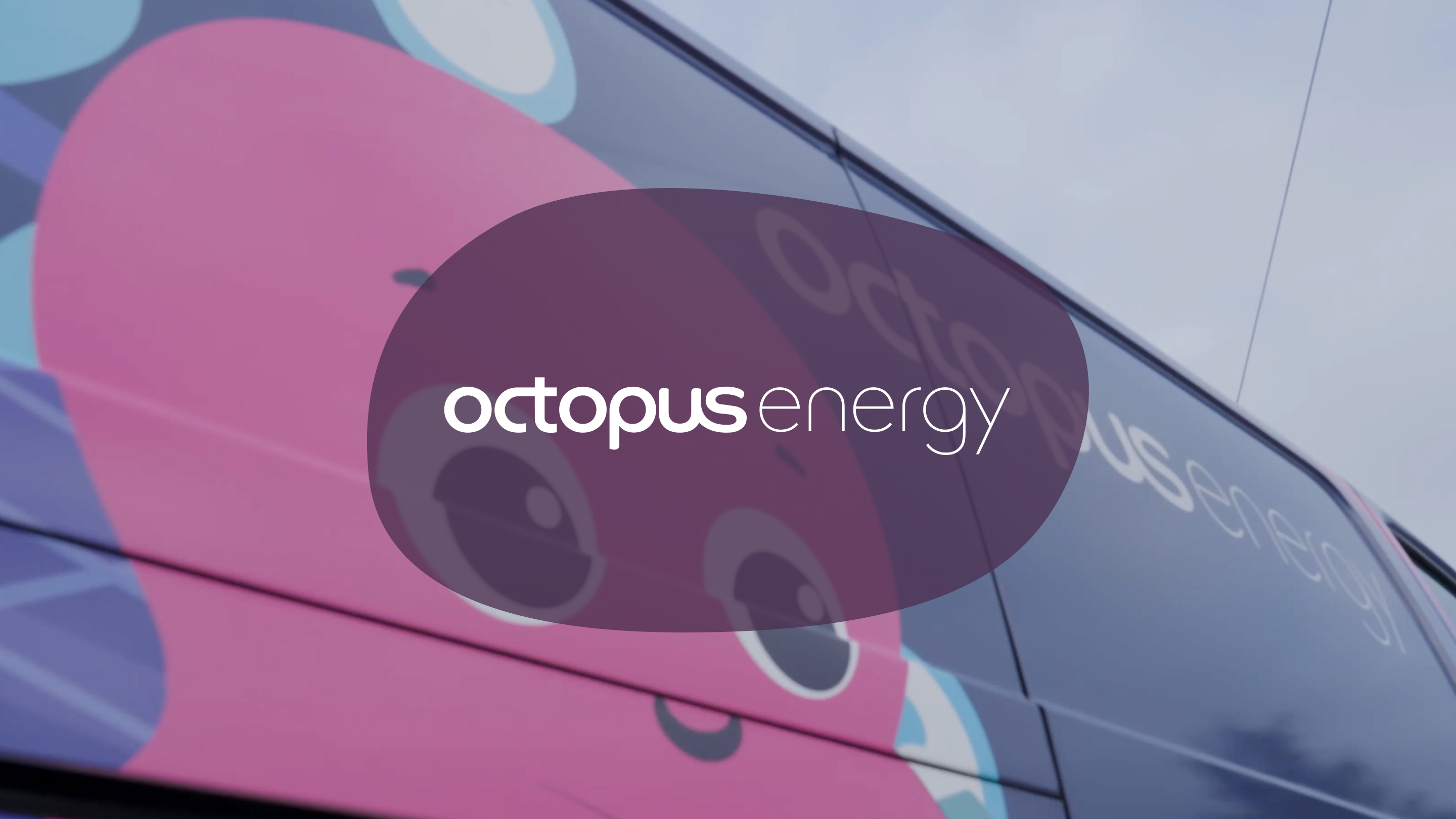 Octopus Energy logo and a pink octopus character on the side of a bus.
