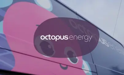 Octopus Energy logo and a pink octopus character on the side of a bus.