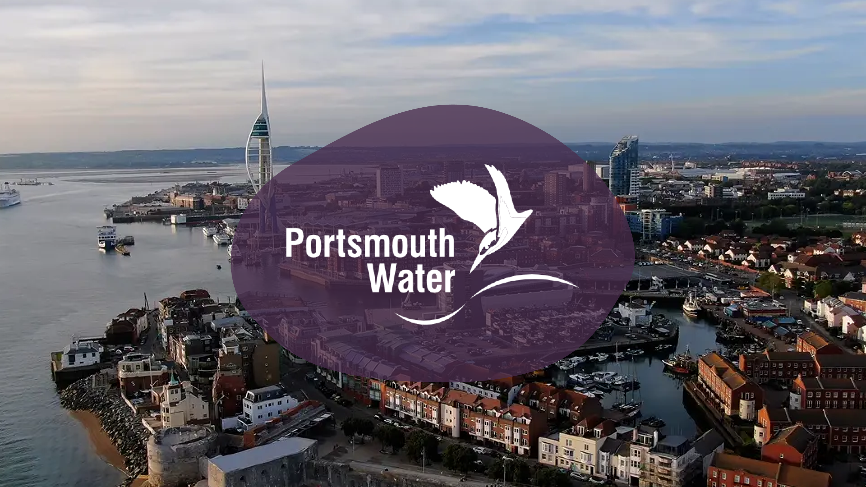 Aerial view of Portsmouth with Spinnaker Tower and Portsmouth Water logo.