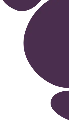 Yellow circular sign with "good energy" in silver letters, mounted below "welcome to" on a white wall.