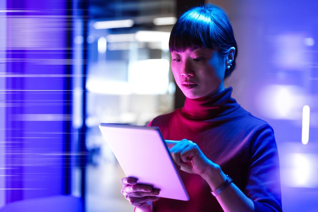 Businesswoman using digital tablet in office