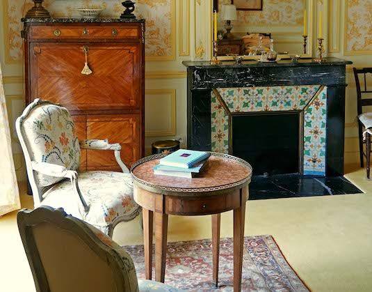Chambre Jaune: marquetry secretaire, marble fireplace with tiles, round table and armchair