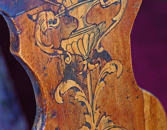 Detail of inlaid marquetry on a Dutch chair back: urn and foliate scrolls