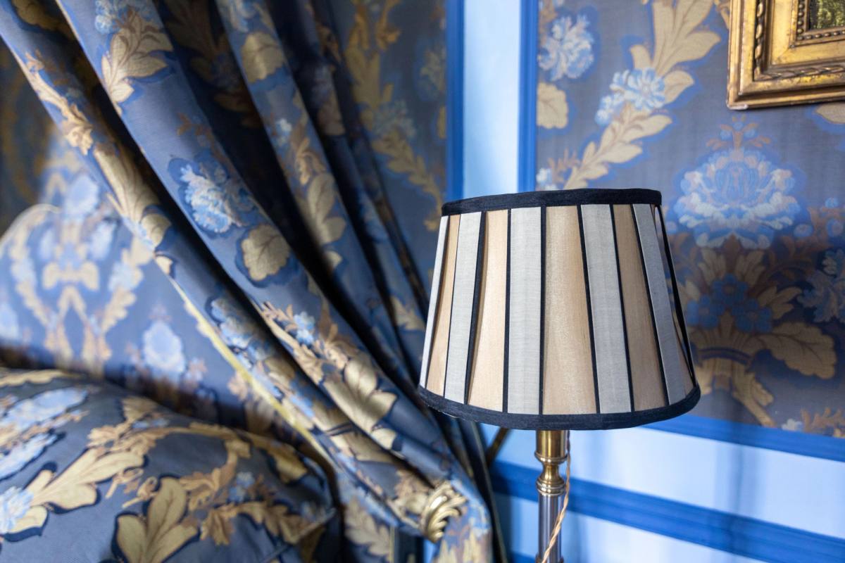 Bedside lamp against blue and gold damask curtains, Chambre Marin de Vanssay