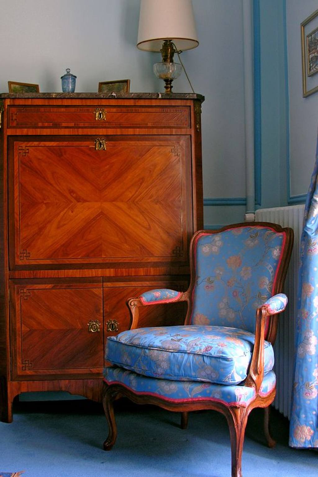 Marquetry secretary desk and blue floral Louis XV armchair in the Chambre Turquoise