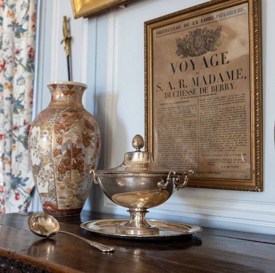 Grande Salle à Manger: framed notice of the Duchesse de Berry's journey, a silver tureen and a Japanese vase