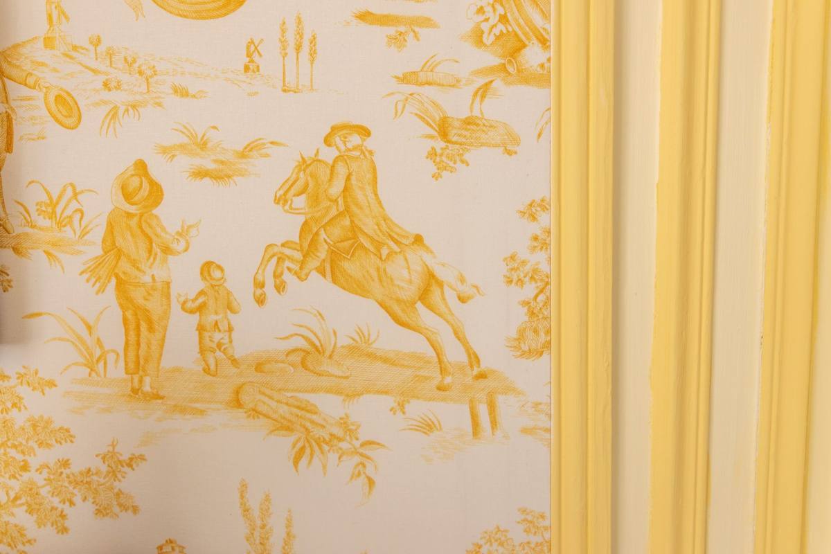 Detail of the yellow toile de Jouy fabric with a horseman and figures, Chambre Jaune