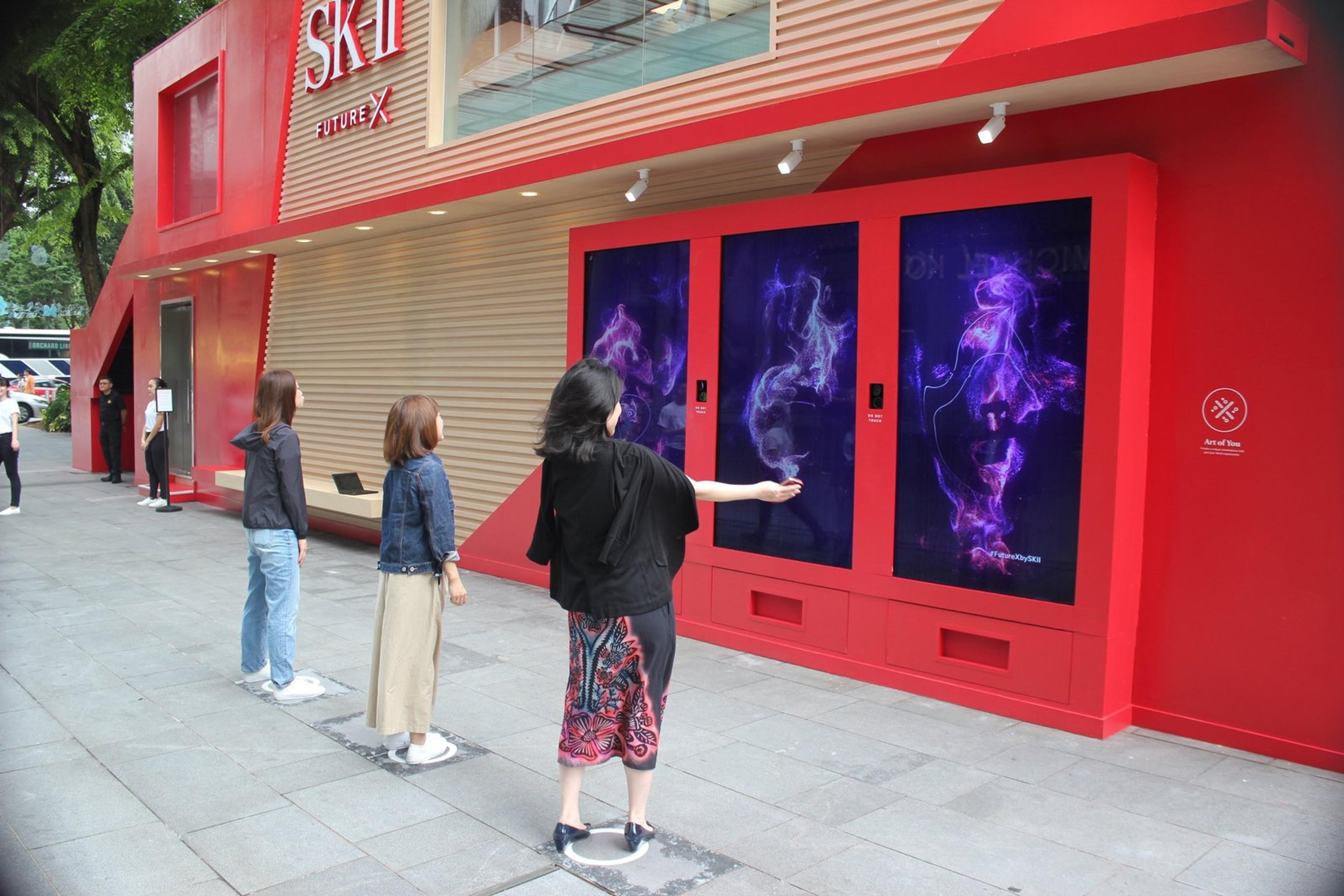 Art of You exterior installation - visitor's face being translated into generative art