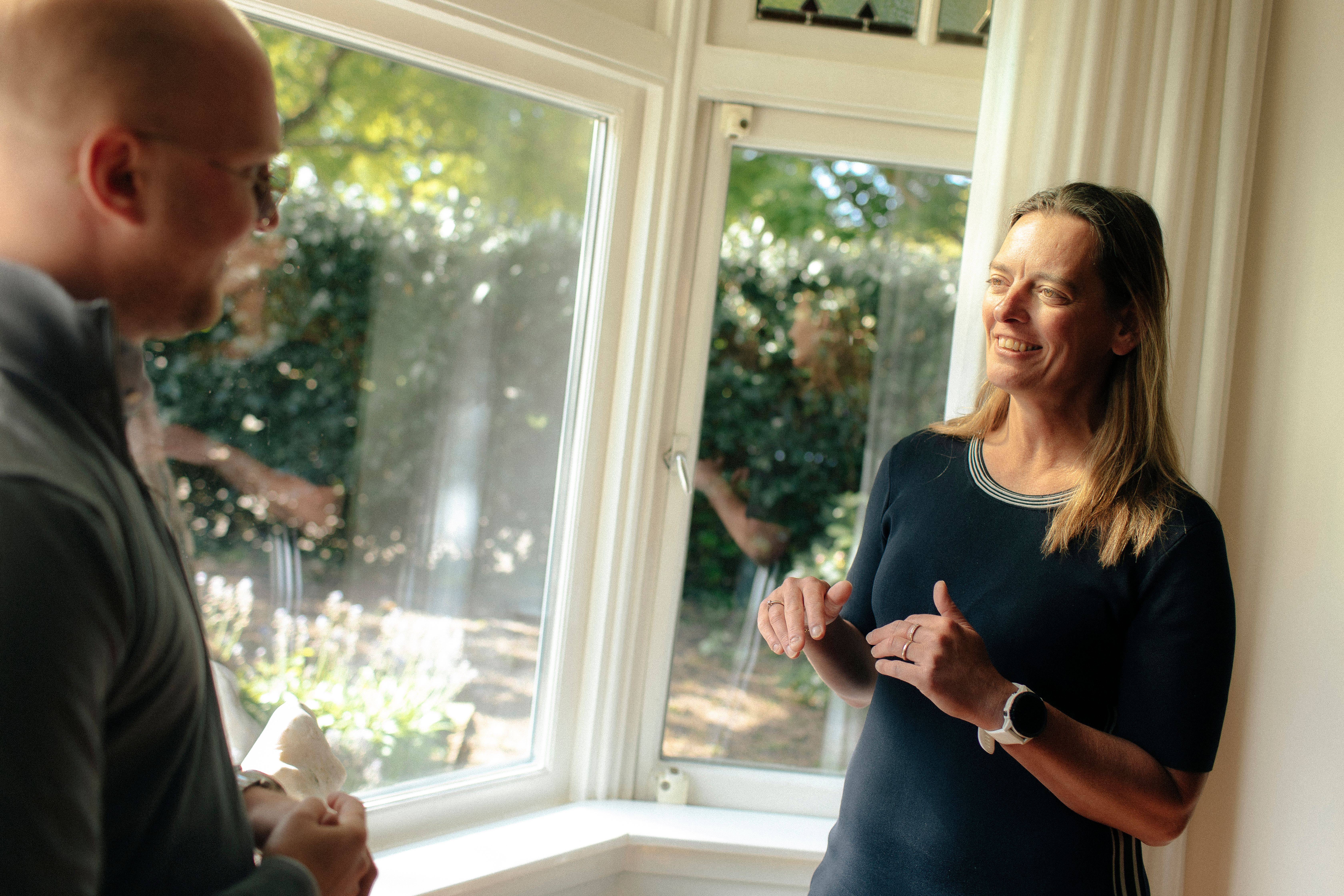 Petra and colleague in front of the mirror