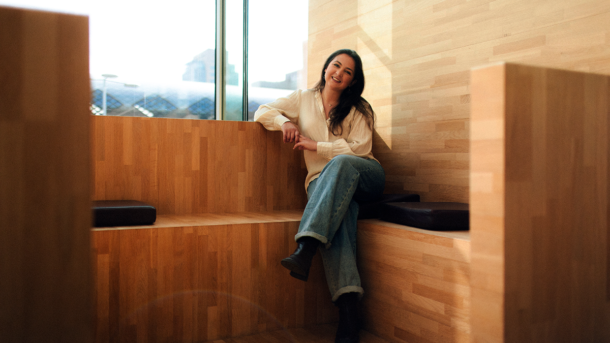 Sophie sitting on a wooden bench