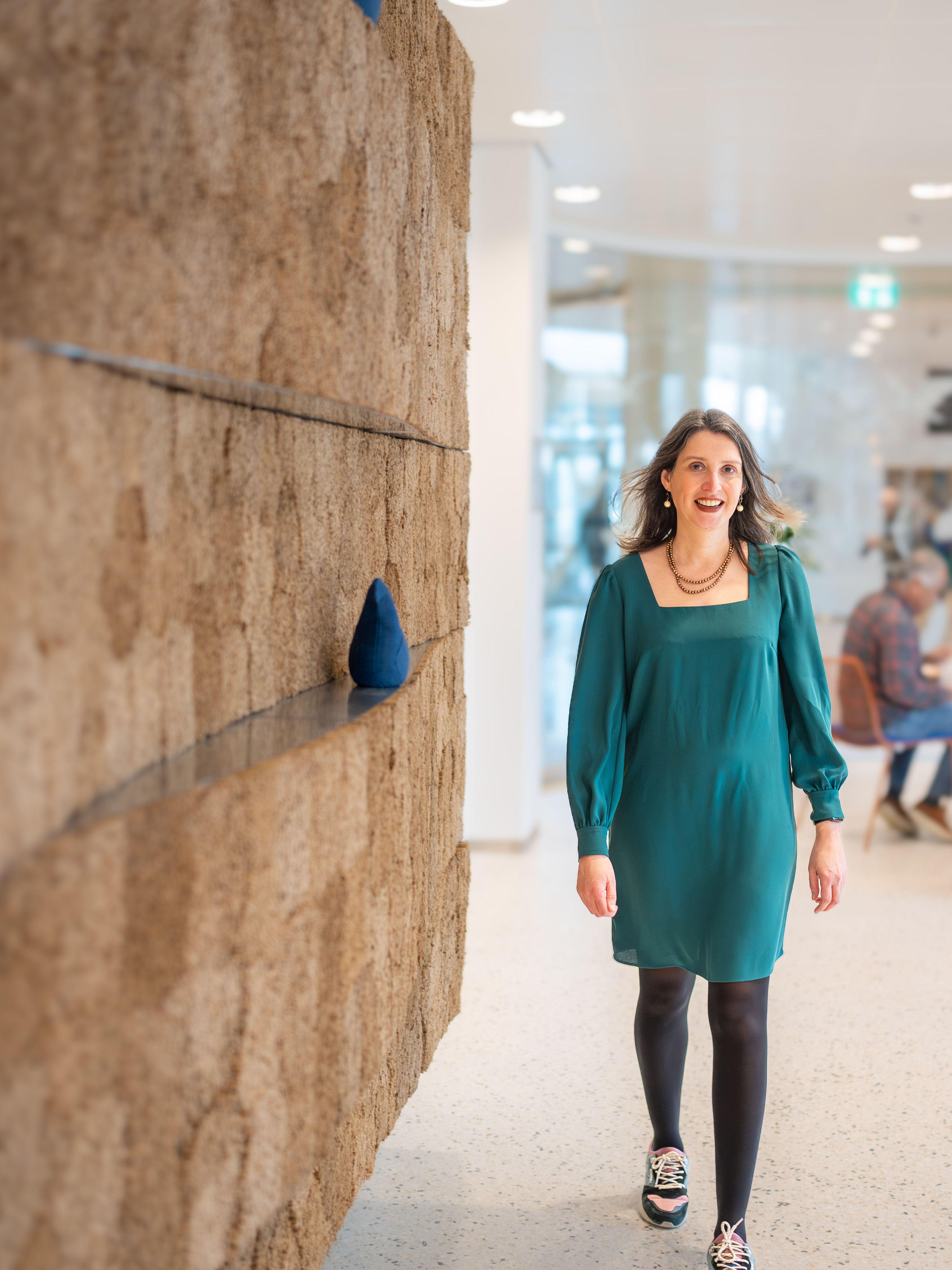 woman walking around the office