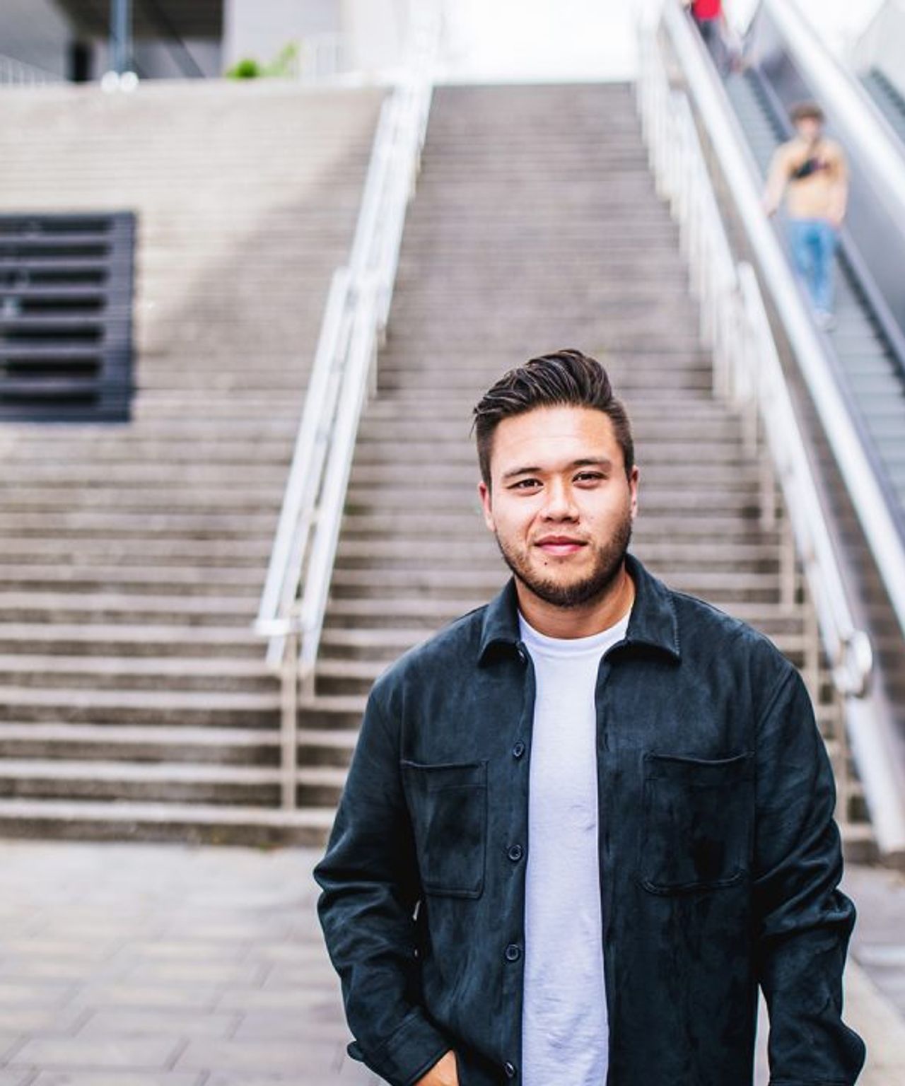 Man in front of stairs