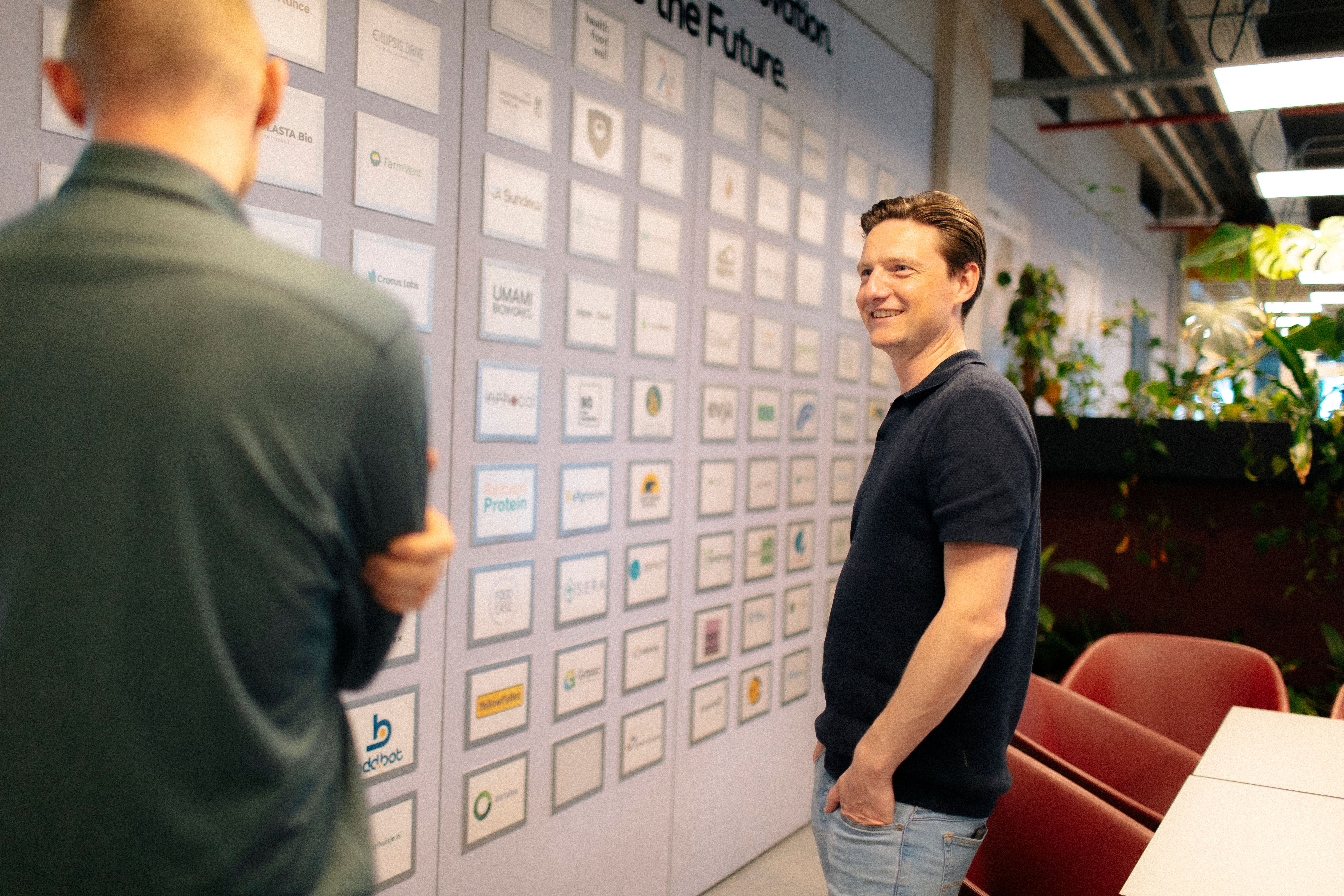 Man in front of a sponsorwall