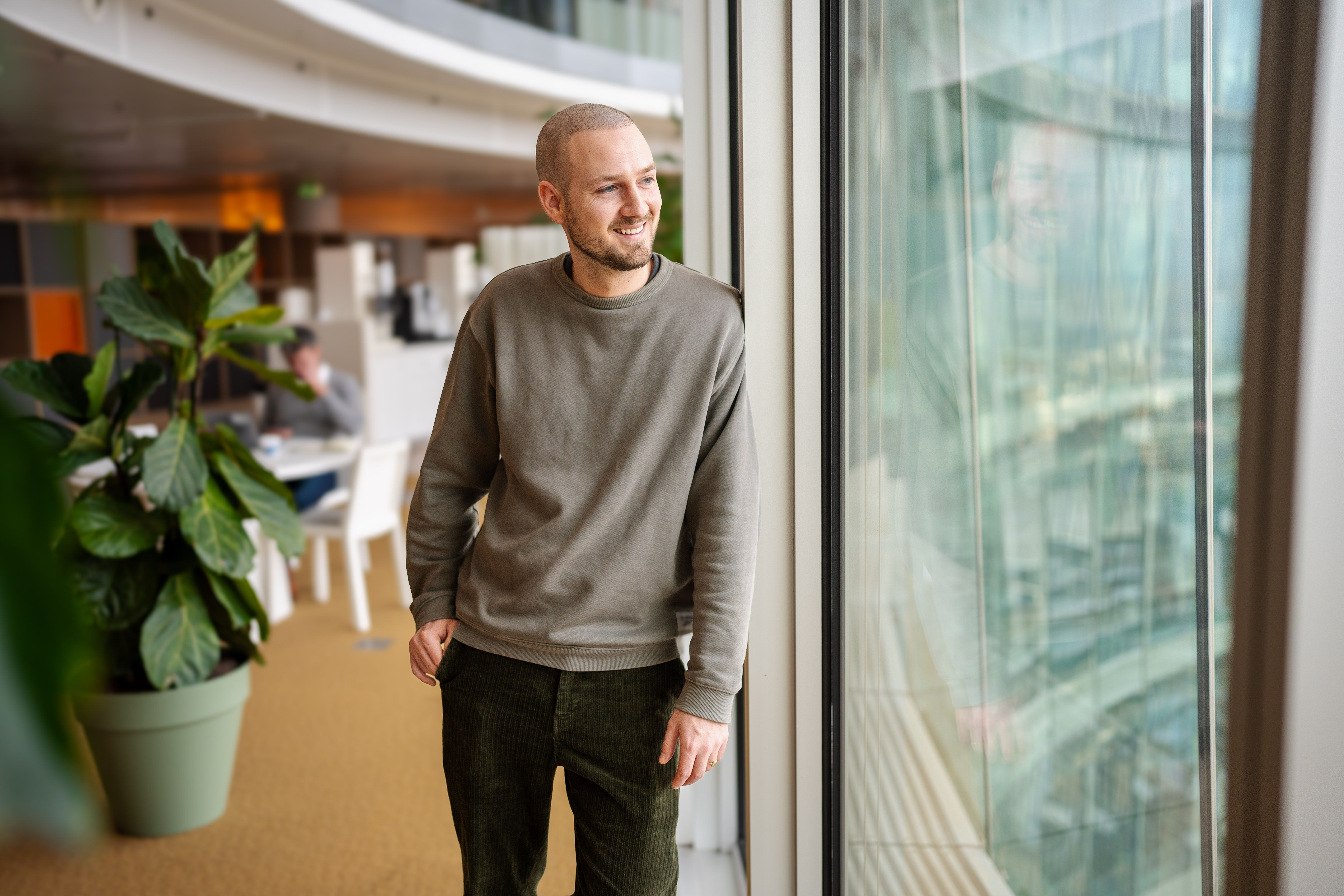 man looking out of the window