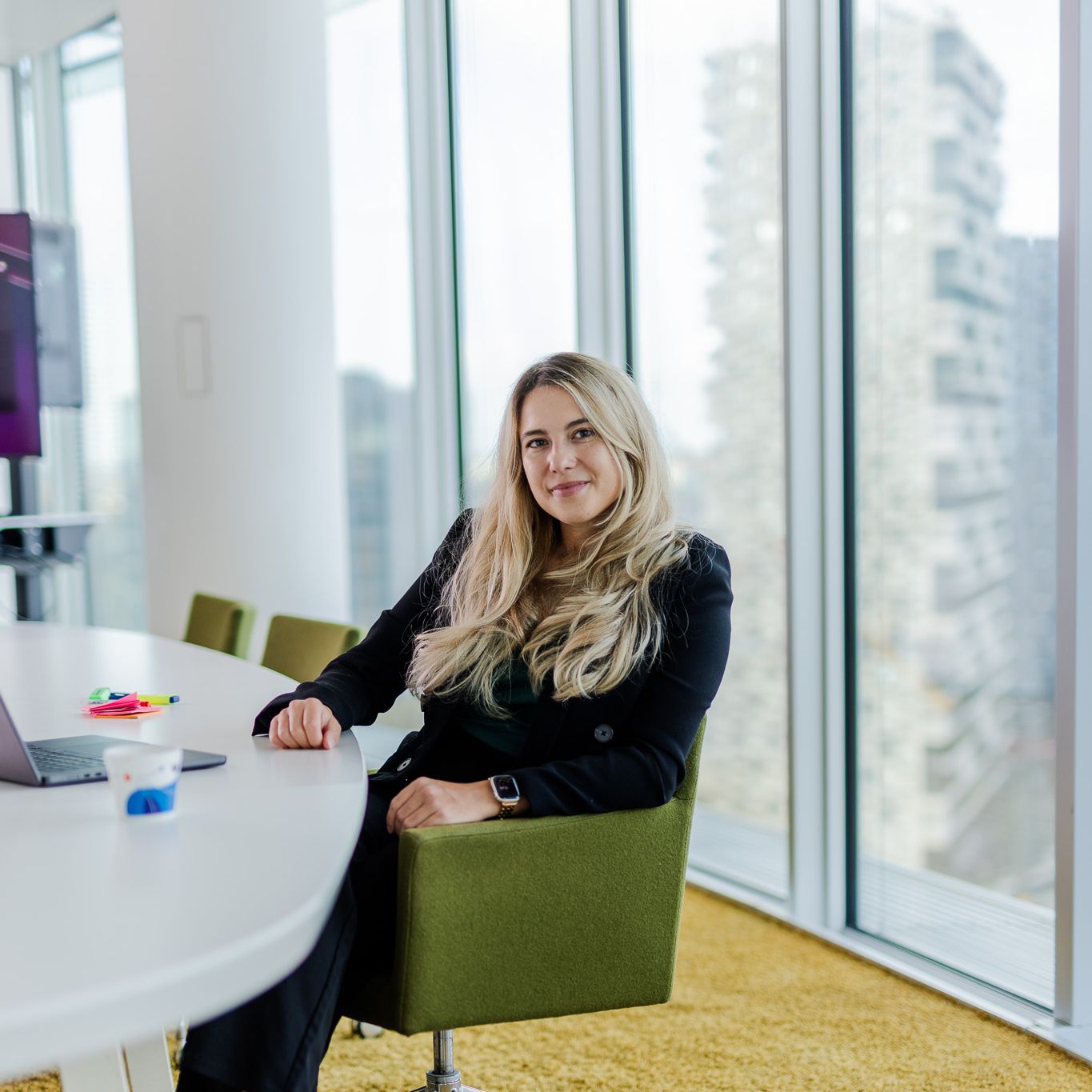 Woman sitting at a big table