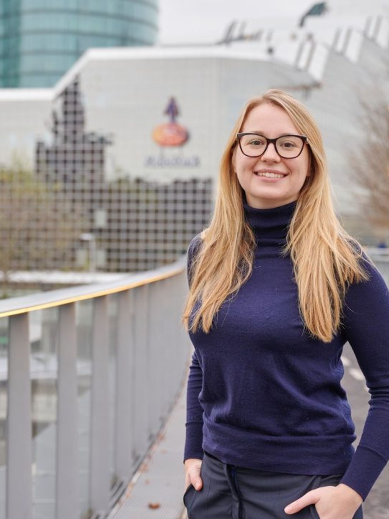 Paule outside at cycling path in front of Rabobank office