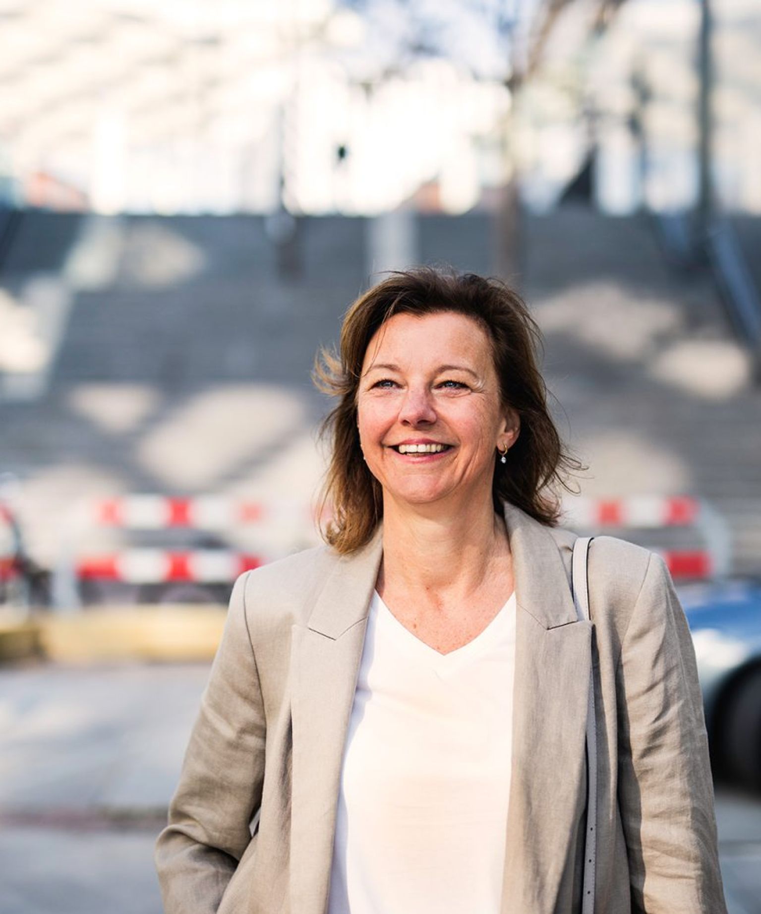 Colleague Eveline in front of open bridge.