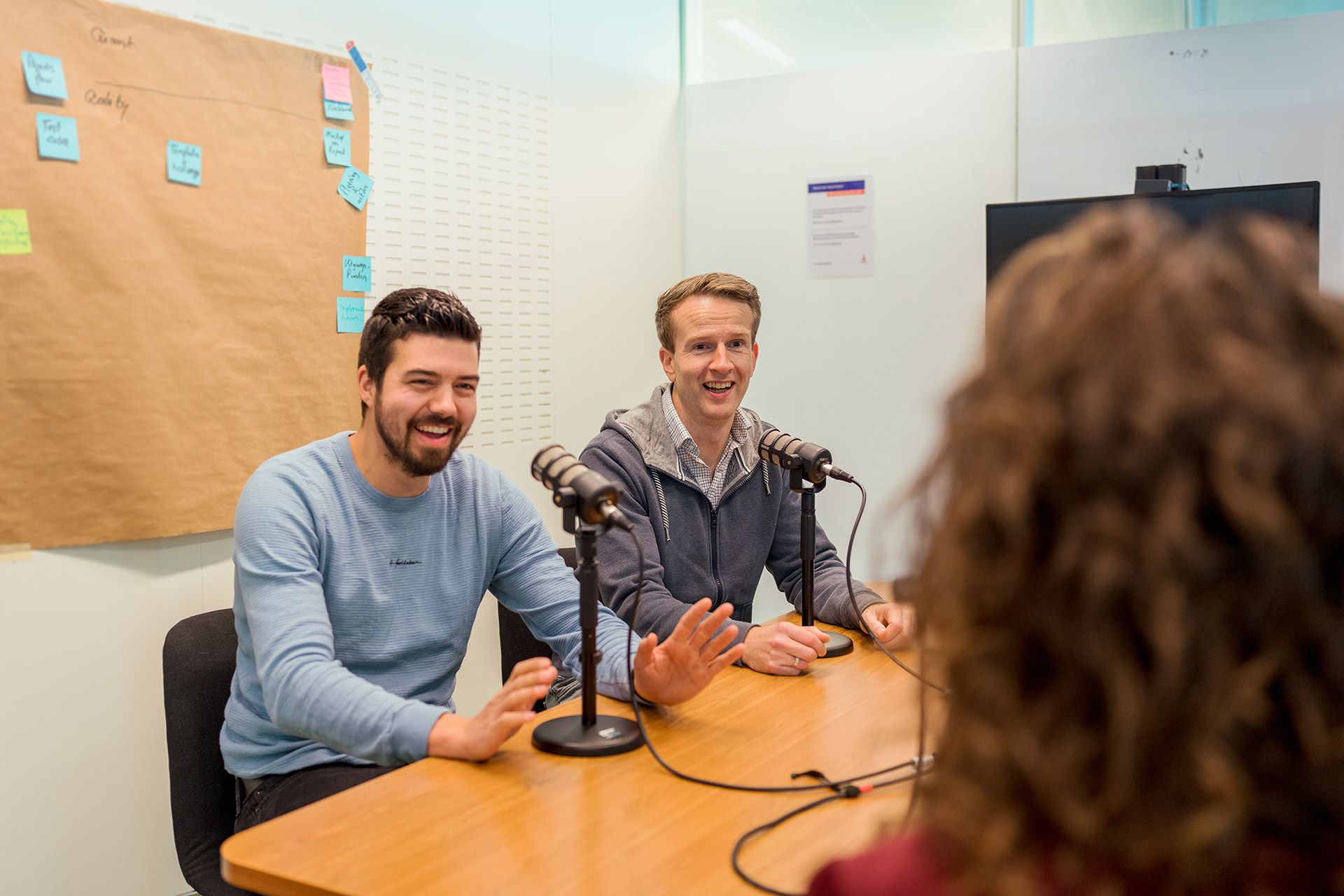 Two men recording podcast