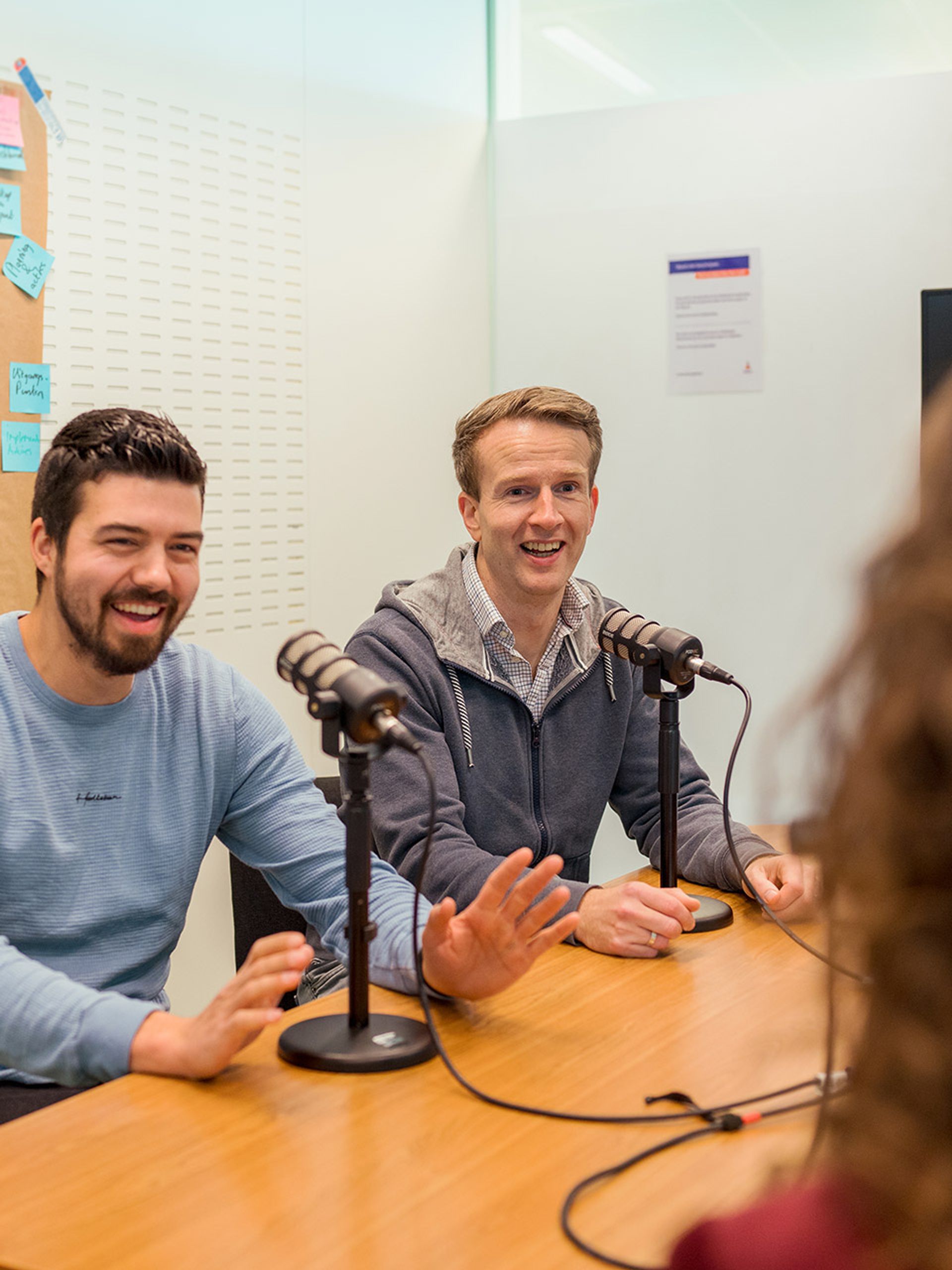 Two men recording podcast