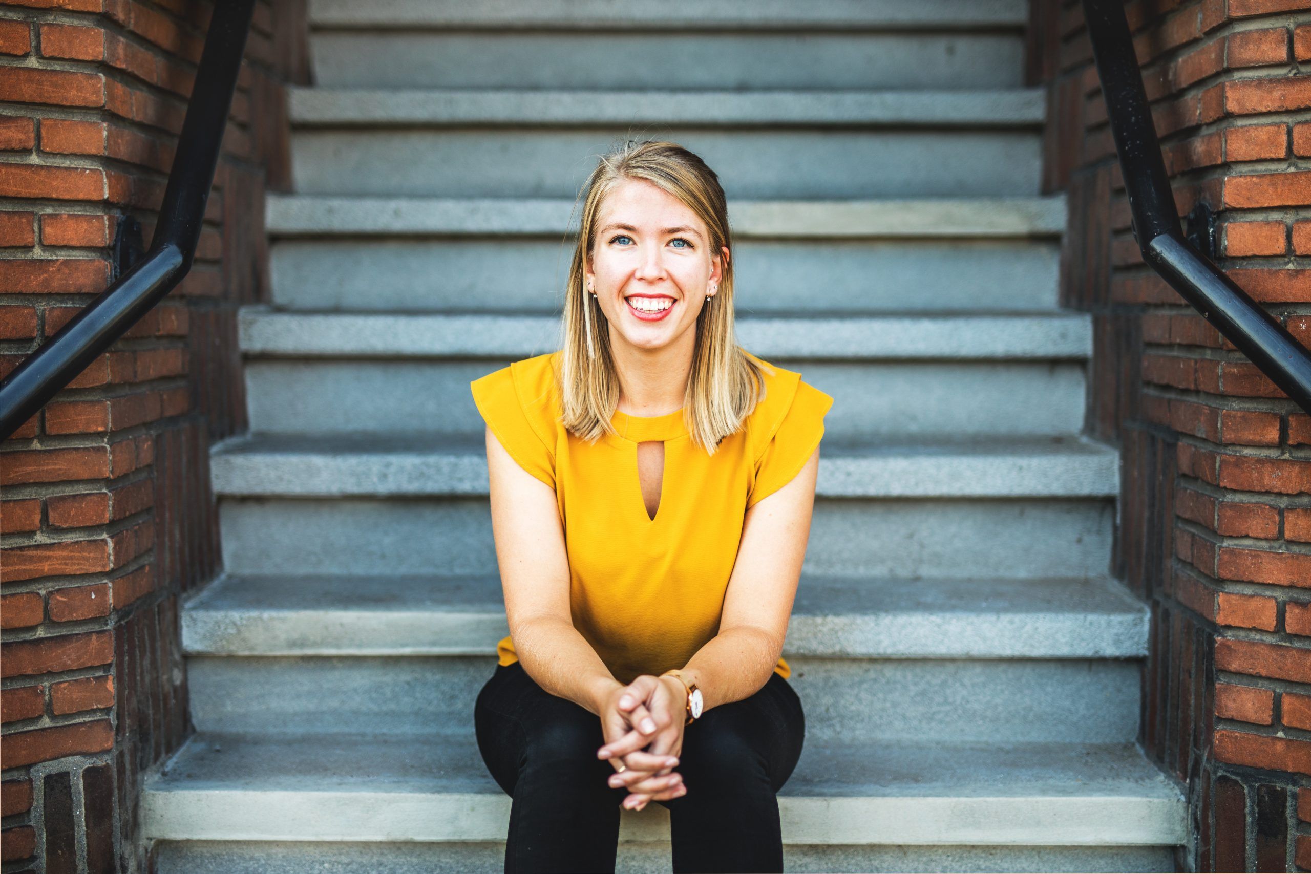 Jasmin sitting on stairway