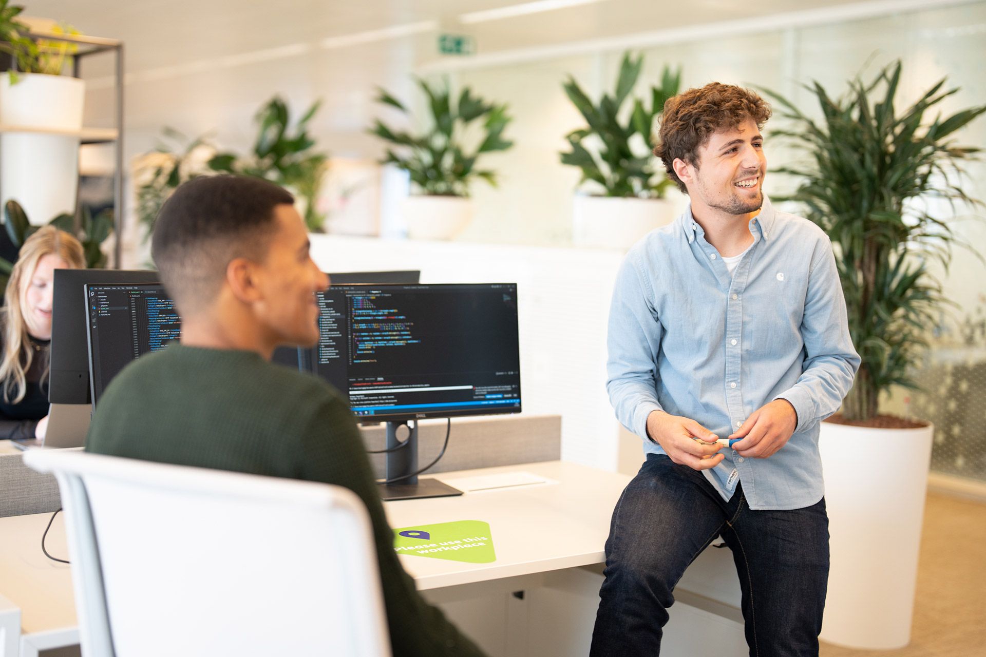 Two young men in conversation.