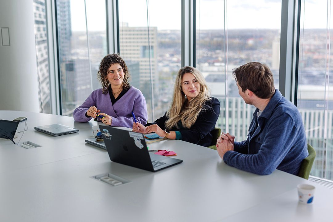 three colleagues working together