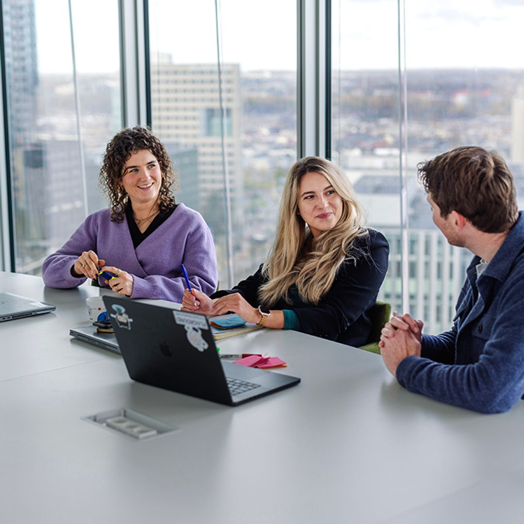 three colleagues working together
